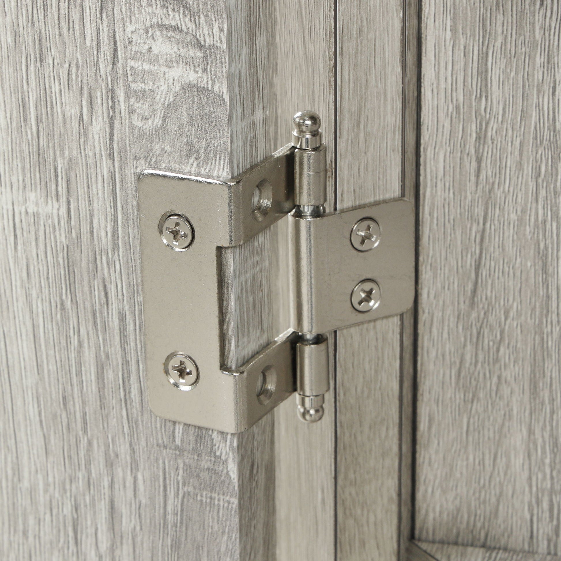 HouseOfZazla linen cabinet hinge close-up on gray wood grain door on Tampa Home & Garden Store