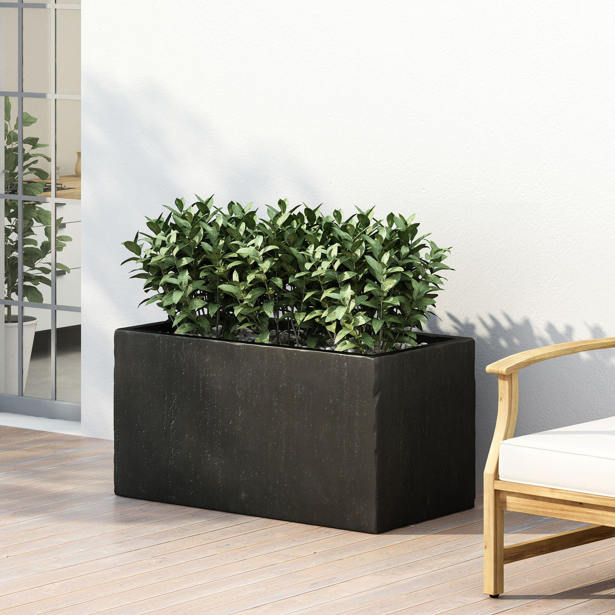 Modern Outdoor Planter by HouseOfZazla, black rectangular planter with lush green foliage on Tampa Home & Garden Store
