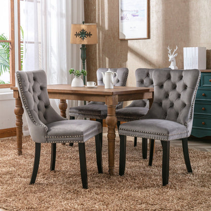 Tufted velvet gray 4-chair set with nailhead trim around a wooden table by HouseOfZazla on Tampa Home & Garden Store