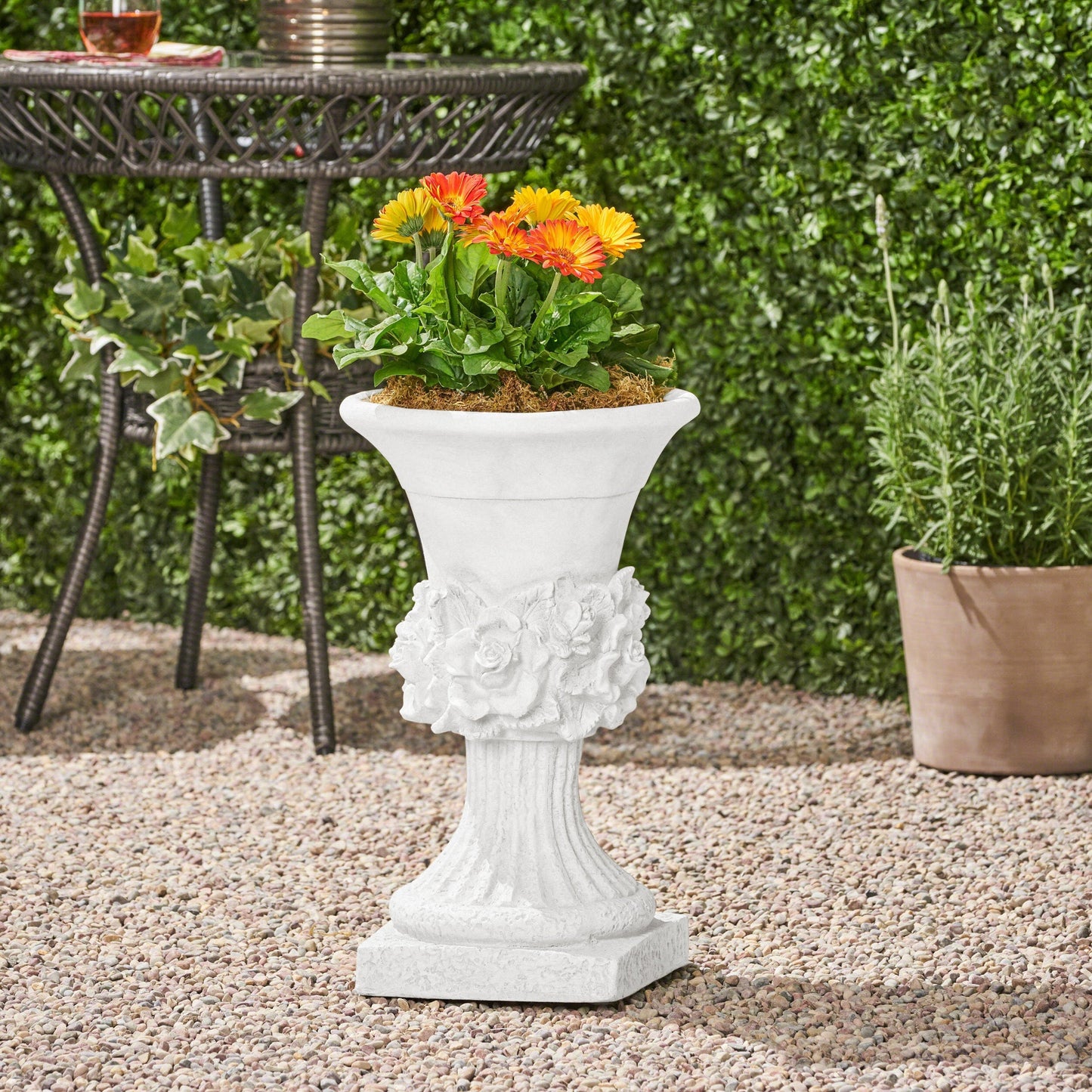 MGO Garden Urn Planter by HouseOfZazla, white stone finish with orange and yellow gerberas on Tampa Home & Garden Store