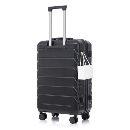 Black hard-shell spinner luggage with silver handle and four wheels, tag attached on Tampa Home & Garden Store