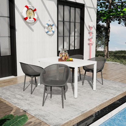 Five-piece outdoor lounge set with long white table and dark gray metal chairs for patio on Tampa Home & Garden Store