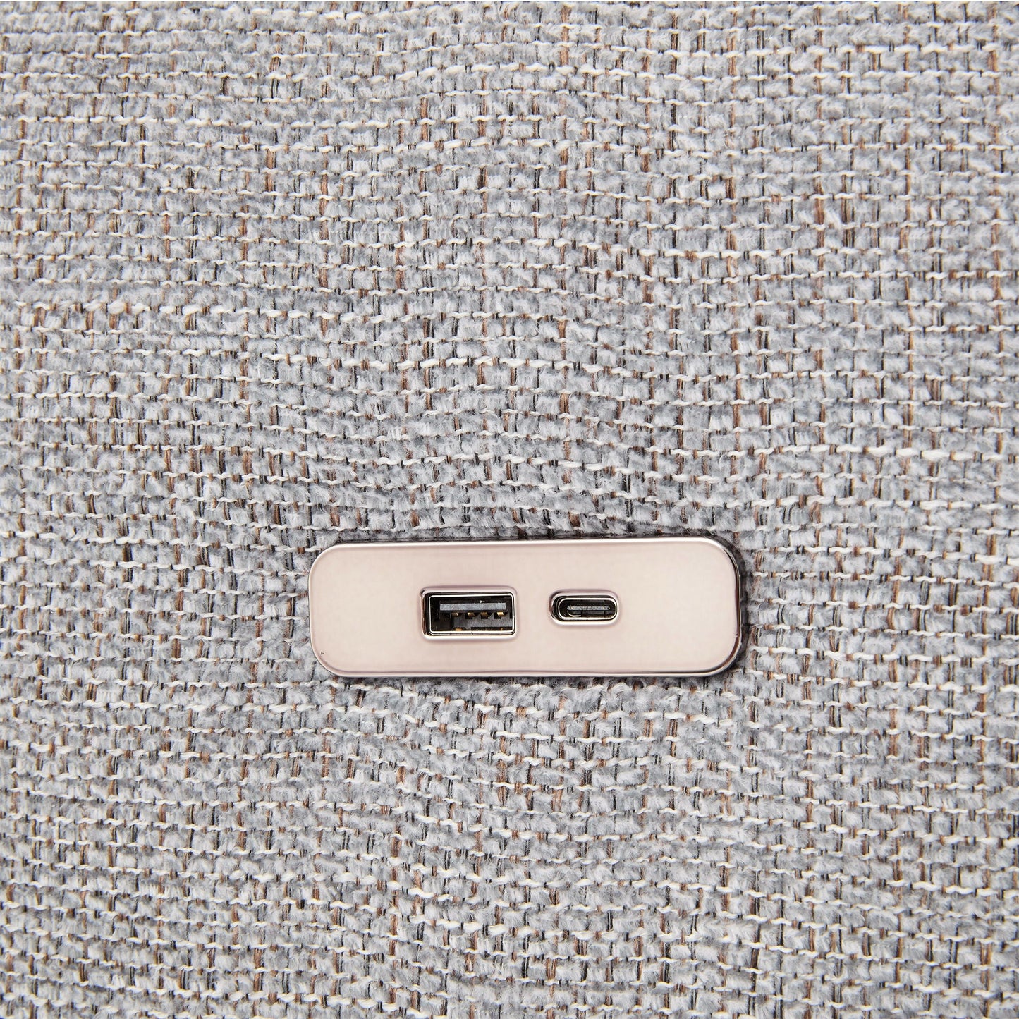 Beige wall outlet with USB ports on gray textured carpet closeup on Tampa Home & Garden Store