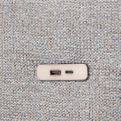 Beige wall outlet with USB ports on gray textured carpet closeup on Tampa Home & Garden Store