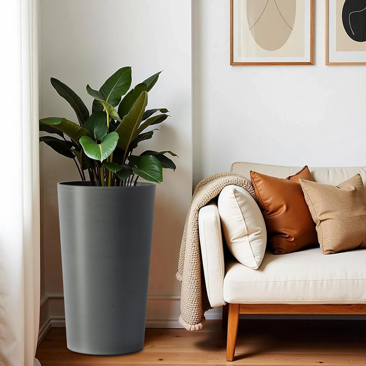 Planter For Outdoor tall gray planter with green leafy plant beside beige sofa in living room on Tampa Home & Garden Store