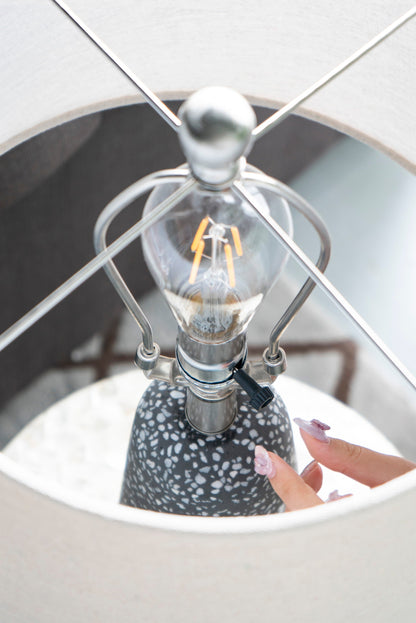 Artisan Multicolor Glass Table Lamp with a speckled gray ceramic base and chrome wireframe on Tampa Home & Garden Store