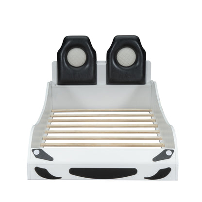 Race car shaped platform bed with two black upholstered backrests, white frame on Tampa Home & Garden Store