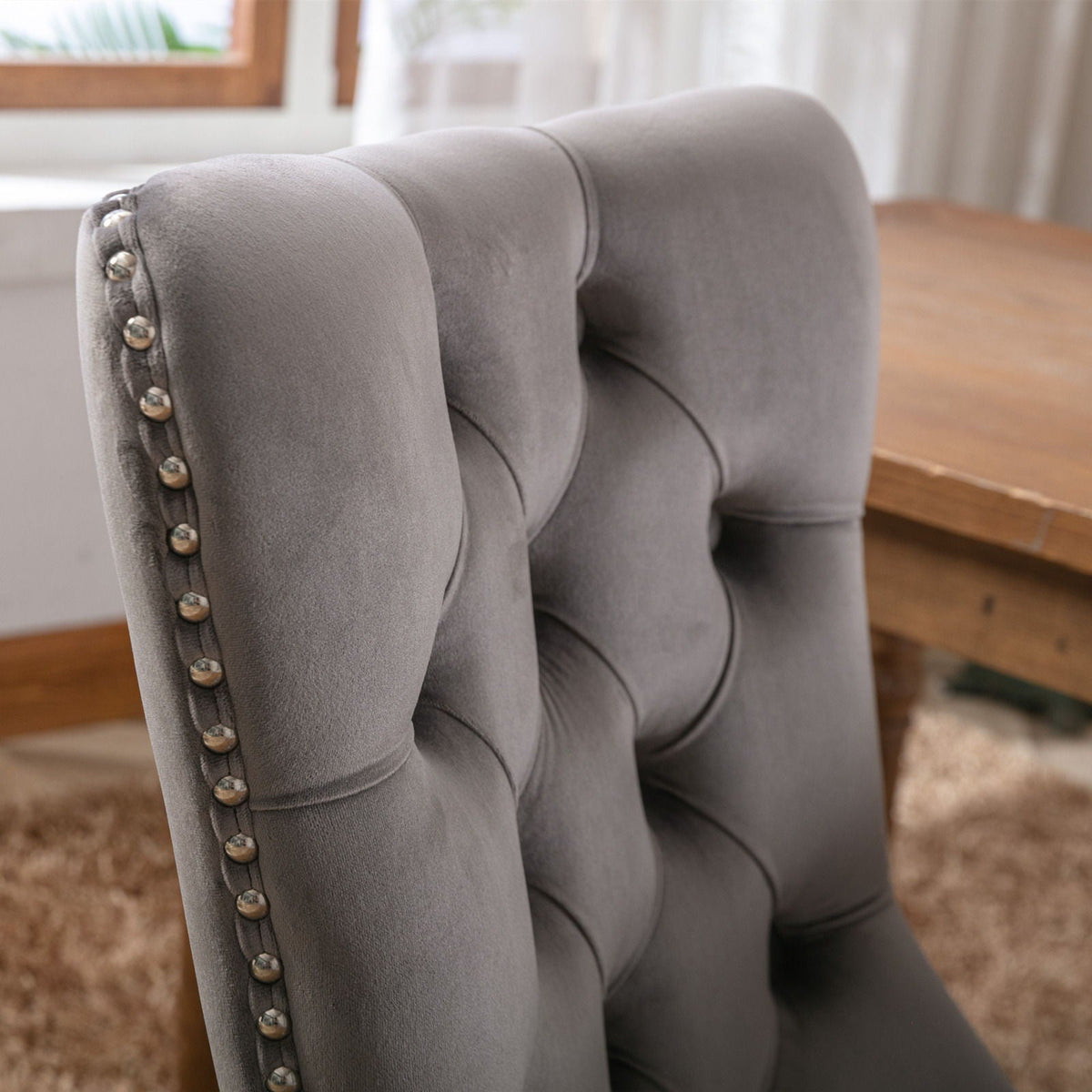 Tufted velvet dining chair set in gray with nailhead trim on Tampa Home & Garden Store