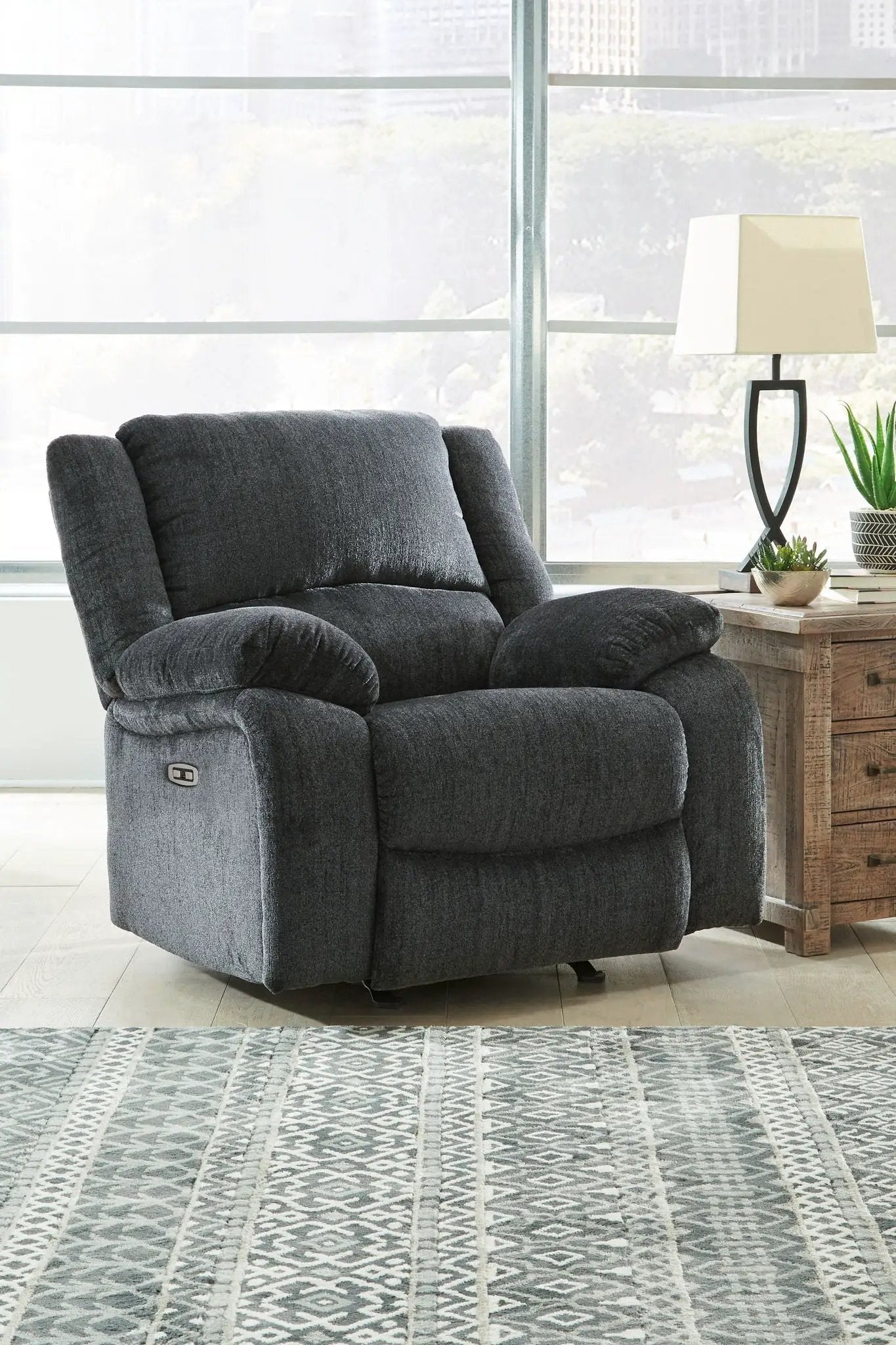 Draycoll rocker recliner by Unique Piece Furniture in dark gray fabric with plush cushions on Tampa Home & Garden Store