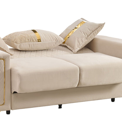 Beige upholstered sofa with gold-tone legs and gold stripe cushions, diamond-quilted seat on Tampa Home & Garden Store