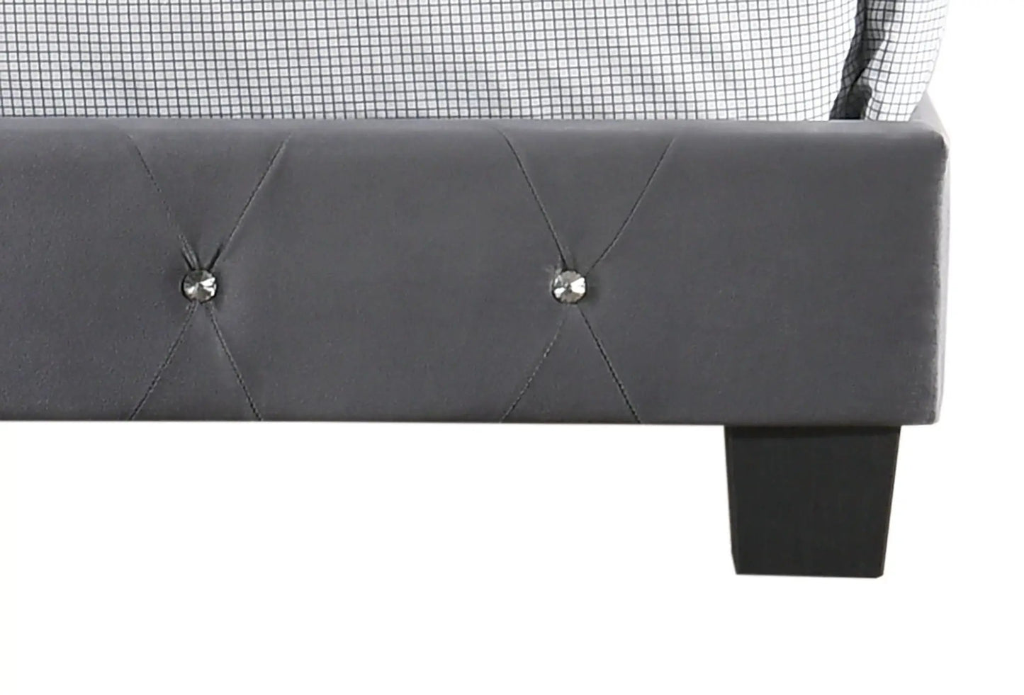 Luxurious dark gray upholstered bed with tufted headboard; black leg visible on Tampa Home & Garden Store
