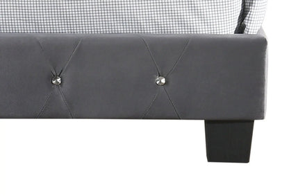 Luxurious dark gray upholstered bed with tufted headboard; black leg visible on Tampa Home & Garden Store