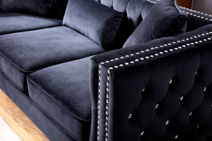 Paige sofa in dark blue velvet with tufted cushions and silver nailhead trim on Tampa Home & Garden Store