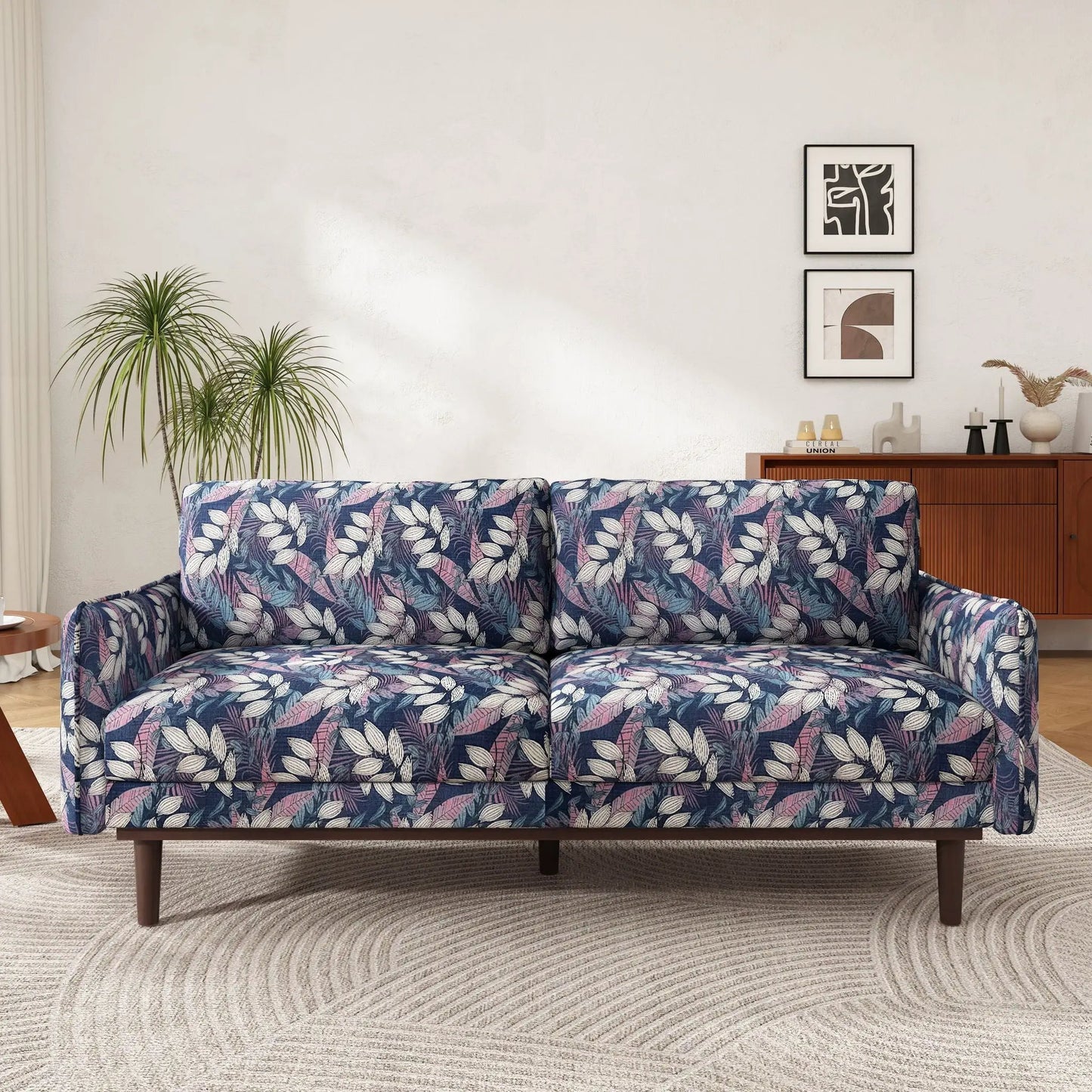 2 seater loveseat with blue-pink leaf print and spacious seating in a stylish living room on Tampa Home & Garden Store