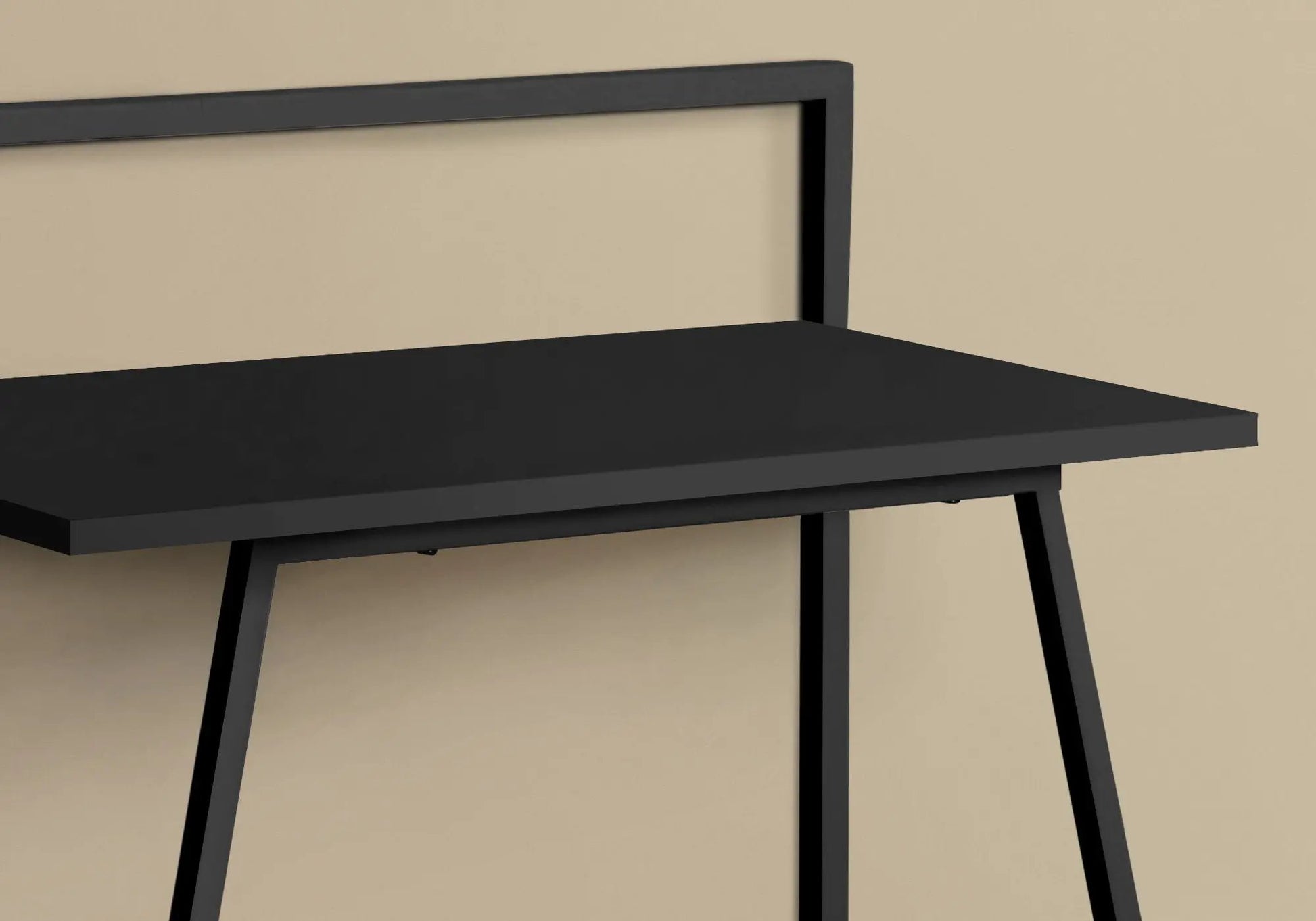 Computer desk with matte black top and angled metal legs, contemporary home office on Tampa Home & Garden Store