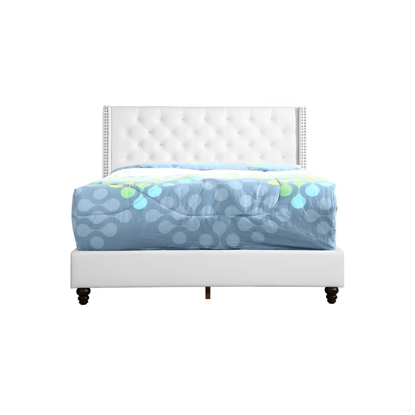 Upholstered nailhead trim bed with white tufted headboard and blue-gray patterned comforter on Tampa Home & Garden Store