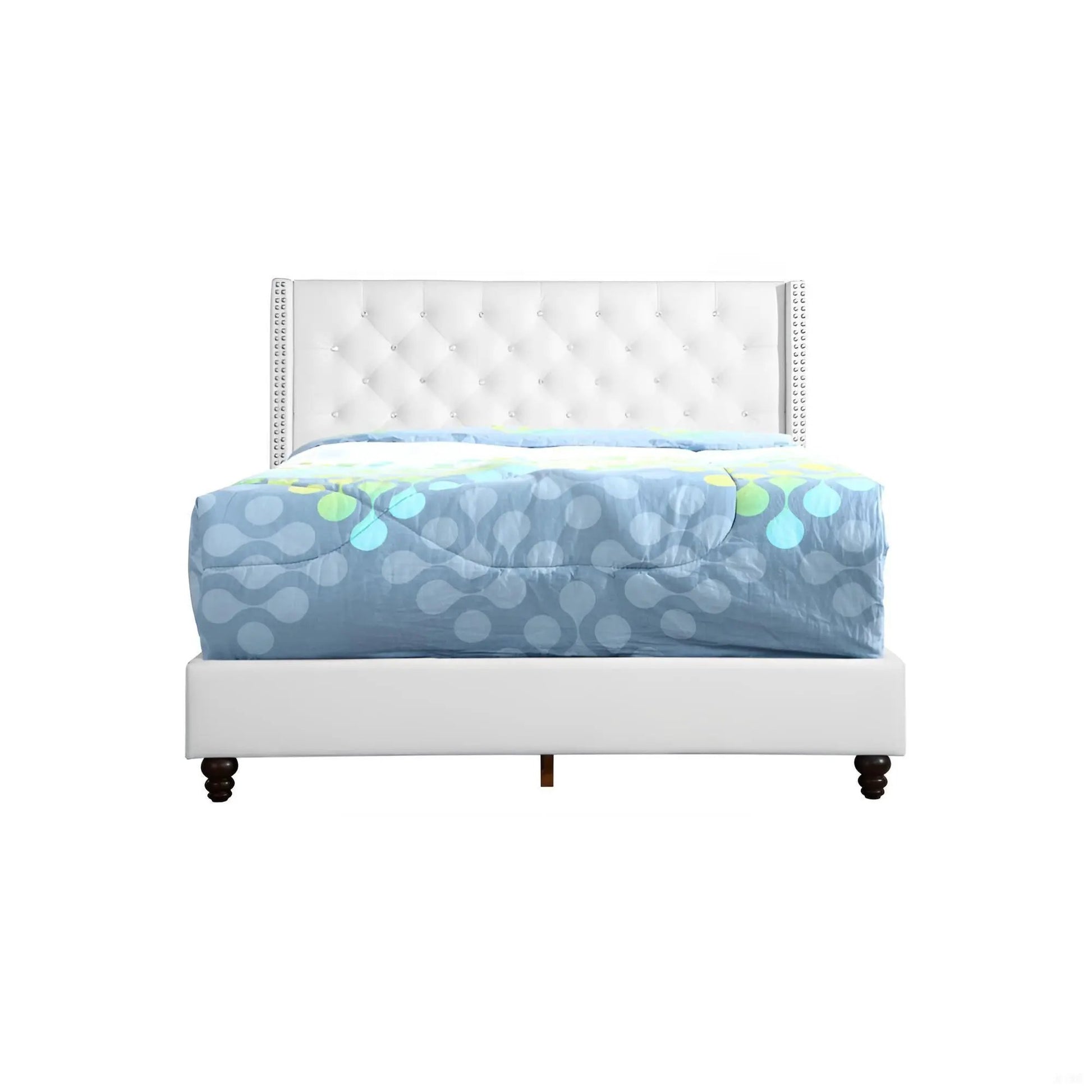 Upholstered nailhead trim bed with white tufted headboard and blue-gray patterned comforter on Tampa Home & Garden Store