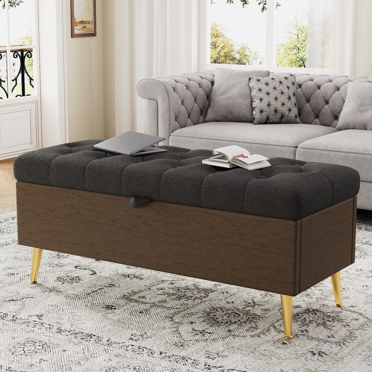 Modern tufted storage ottoman bench with metal legs in dark gray fabric; laptop and book on Tampa Home & Garden Store