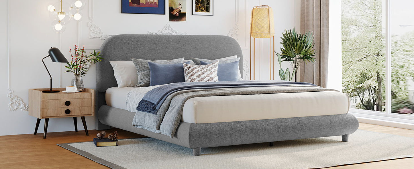 Upholstered platform bed in gray fabric with thick curved frame and headboard by HouseOfZazla on Tampa Home & Garden Store