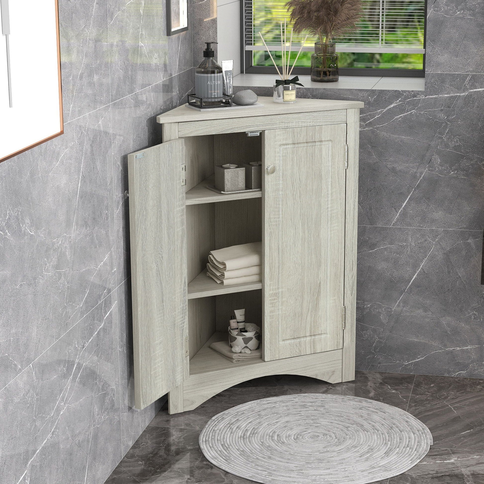 Triangle bathroom storage cabinet in light graywashed wood with adjustable shelves, freestanding on Tampa Home & Garden Store