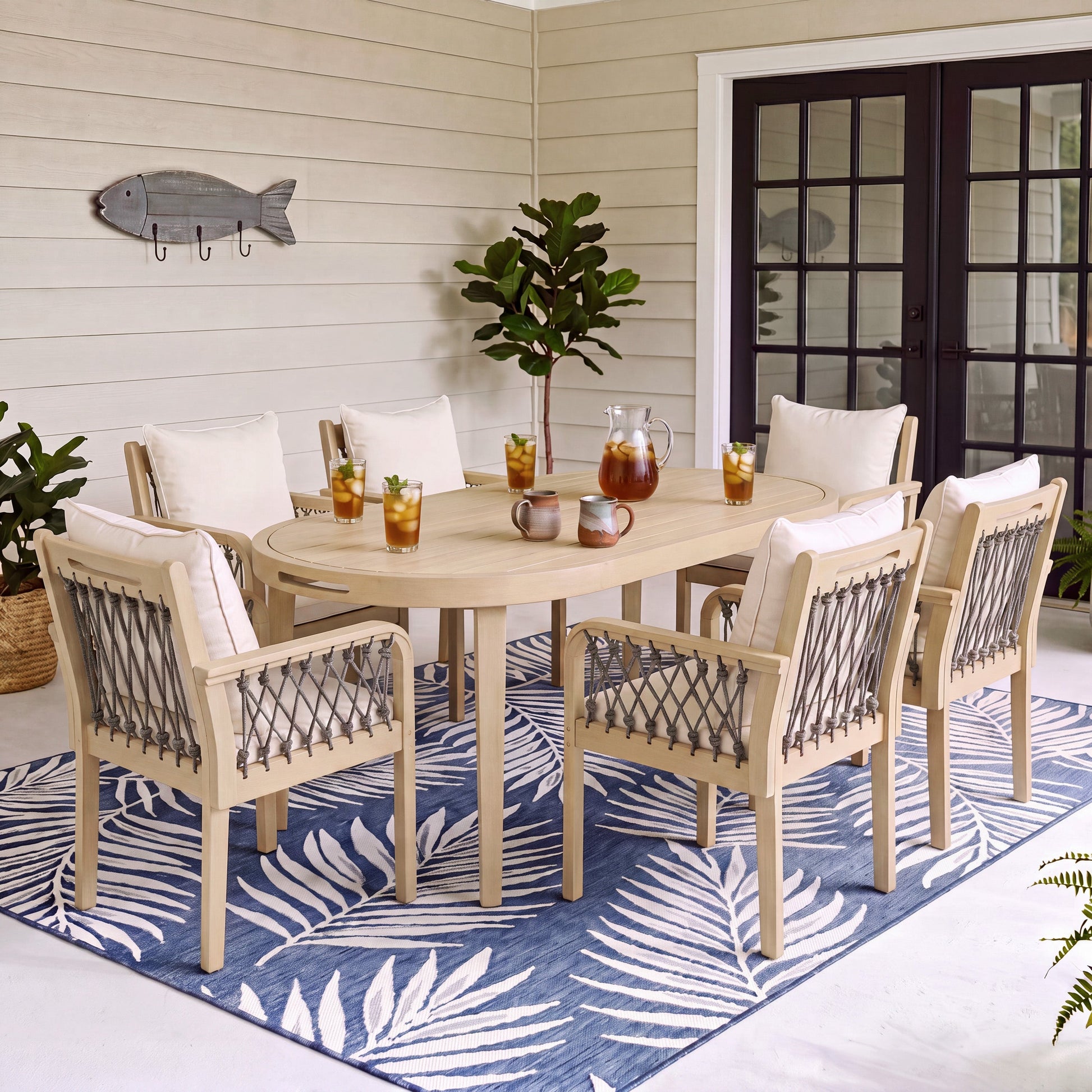 7-Piece Outdoor Acacia Wood Dining Set with wood chairs, cushions, woven backs on patio rug on Tampa Home & Garden Store