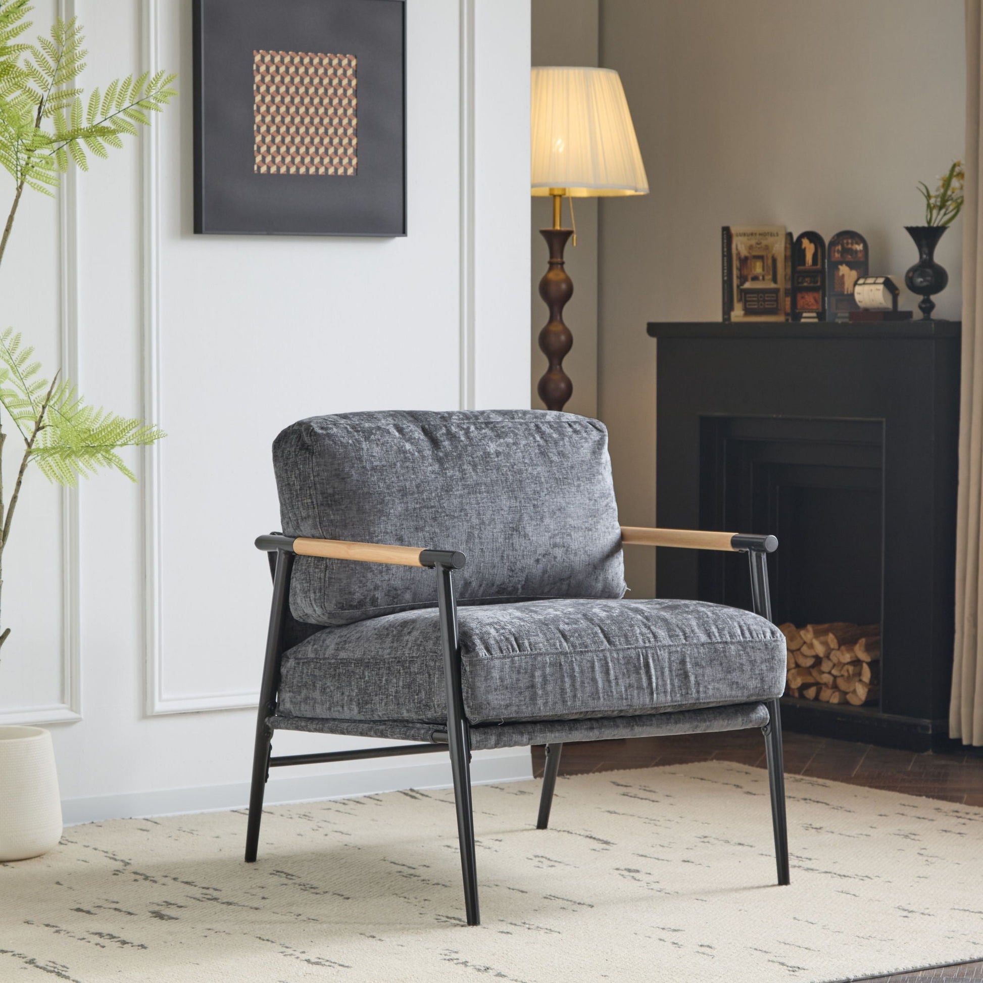 Modern accent chair with plush grey cushions and wooden armrests, black metal legs on Tampa Home & Garden Store