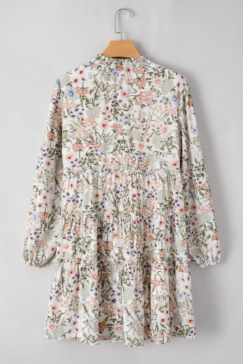 Floral printed mock-neck long sleeve mini dress by Stevvex with tiered skirt in white on Tampa Home & Garden Store
