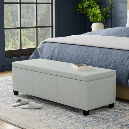 Avalon multifunctional storage ottoman bench in light grey fabric with black block legs on Tampa Home & Garden Store