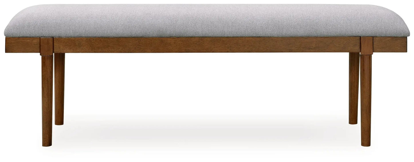 Large upholstered dining bench with gray fabric cushion and brown wood legs on Tampa Home & Garden Store