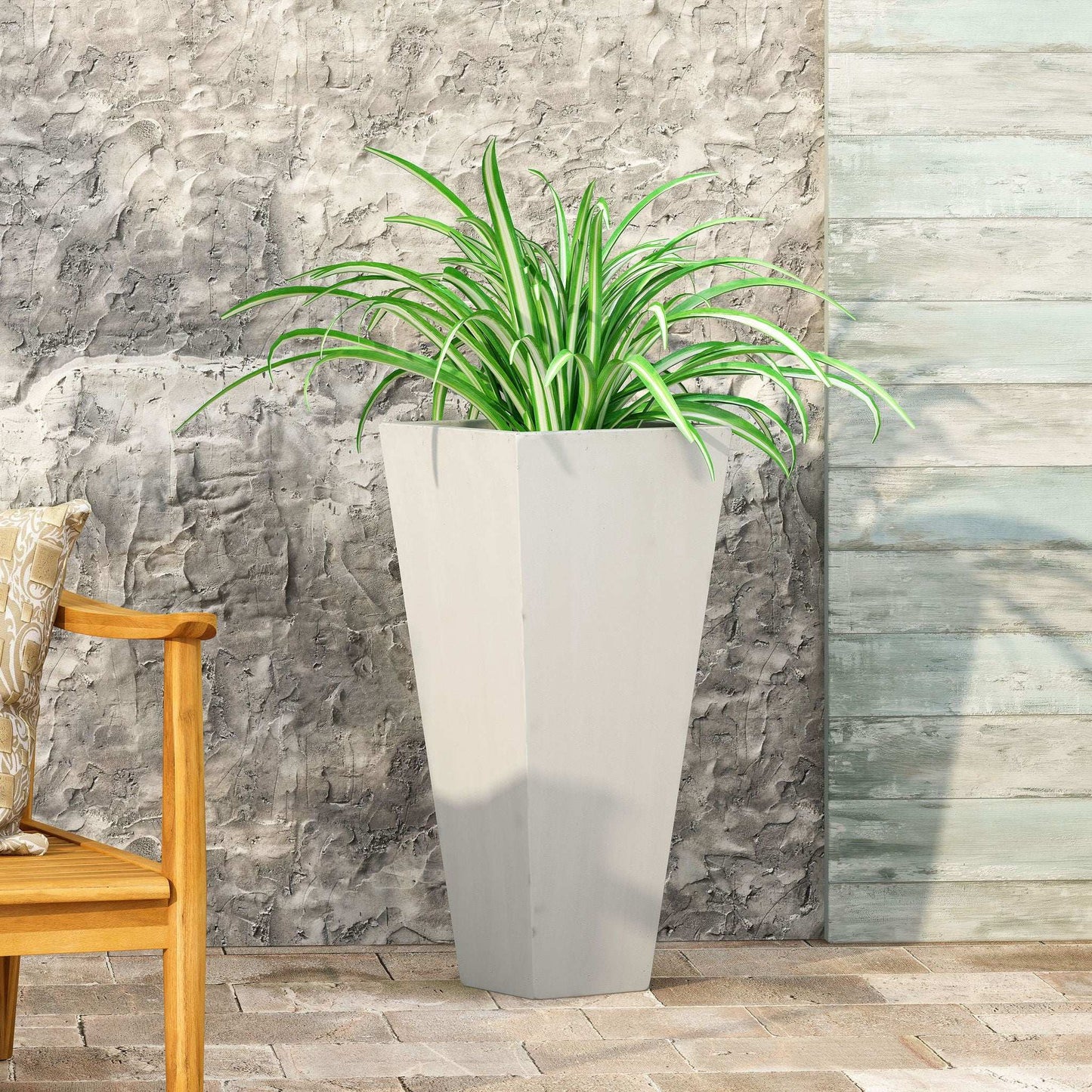 Outdoor Modern Cast Stone Planter tall gray tapered planter with lush green variegated plant on Tampa Home & Garden Store