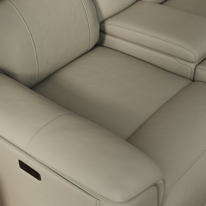 Dual Power Reclining Loveseat and Center Console in beige leather, visible stitching on Tampa Home & Garden Store