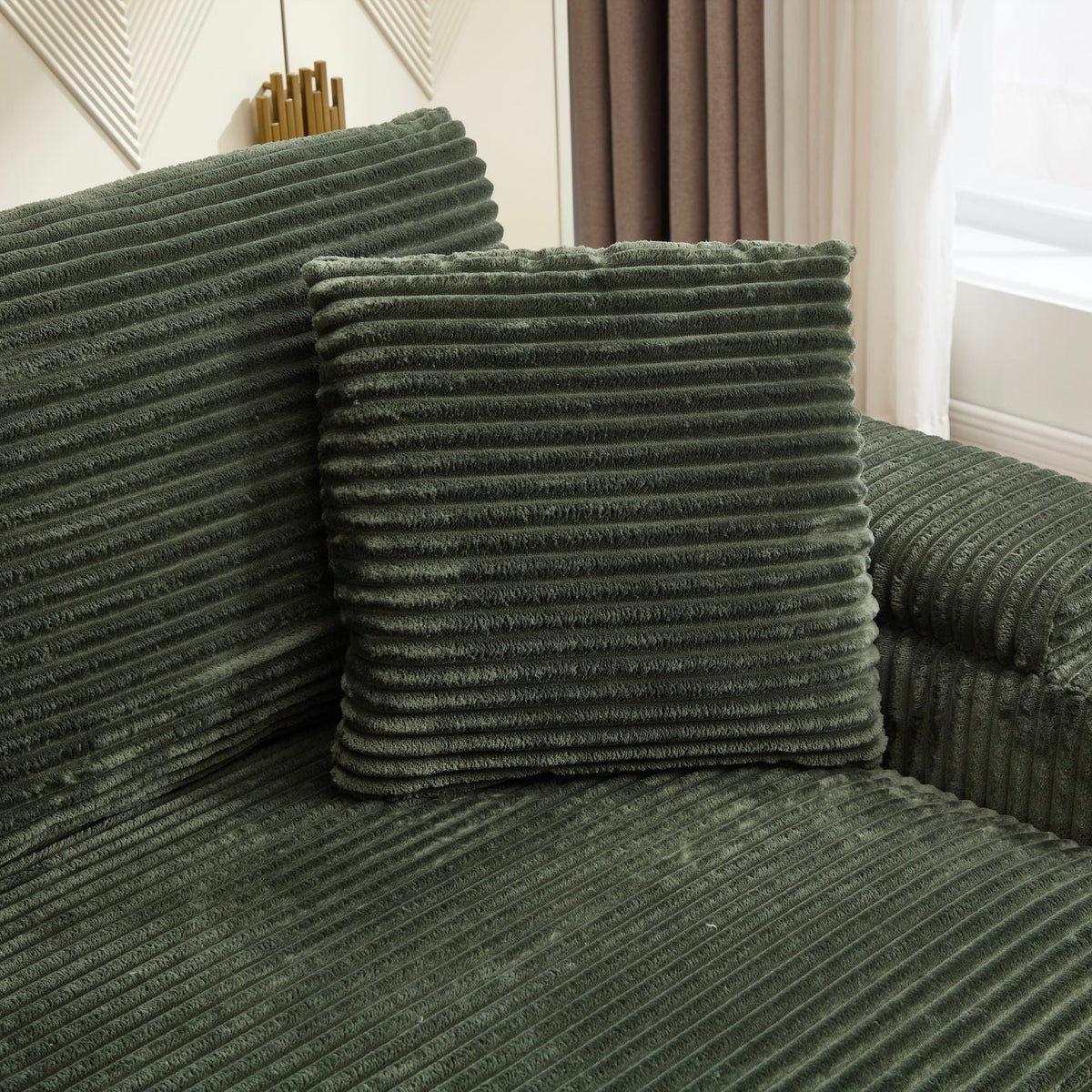 Green ribbed sofa cushions from a 3-piece living room set with plush textured fabric on Tampa Home & Garden Store