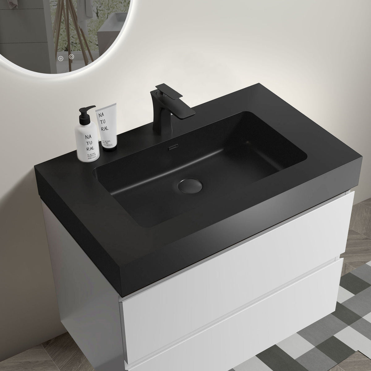 Modern floating vanity with black countertop, white base, matte black faucet, backlit mirror on Tampa Home & Garden Store