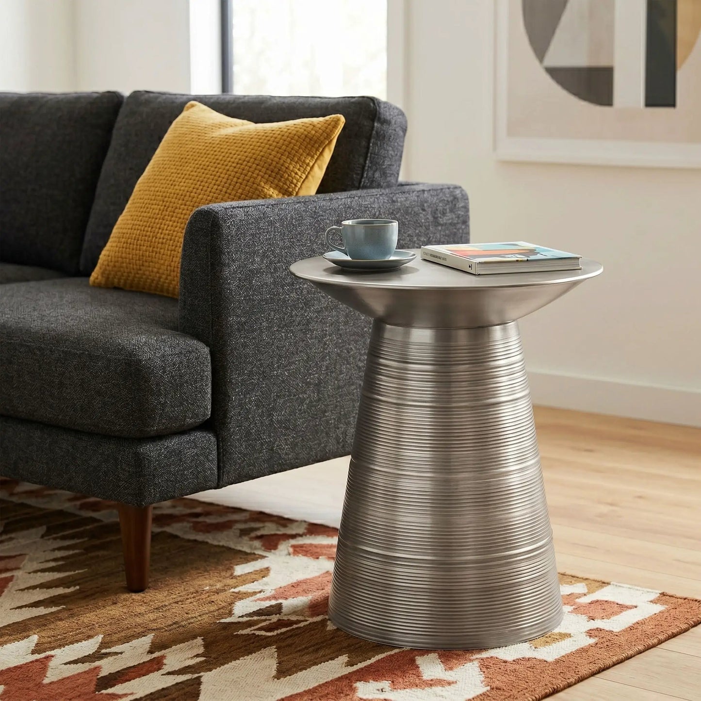 Sheridan handcrafted metal accent table with ribbed base beside a gray sofa on Tampa Home & Garden Store