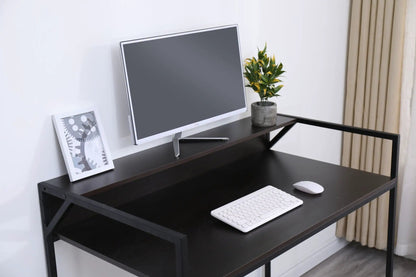 Console table with slim black metal frame and dark wood top, monitor, keyboard, plant on Tampa Home & Garden Store