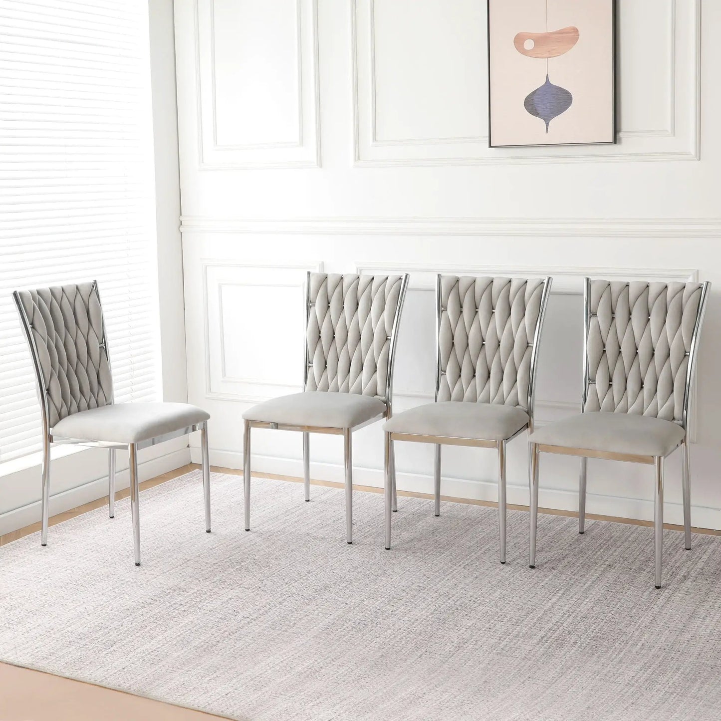 Modern tufted gray dining chairs with chrome legs, five-seat set along white paneled wall on Tampa Home & Garden Store