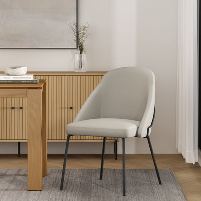 Modern vegan upholstered dining chair with light gray upholstery and black metal legs on Tampa Home & Garden Store