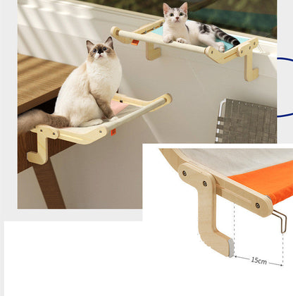 Cat Hanging Bed Hammock by Sell My Stuff, wooden frame with orange fabric, two cats lounging on Tampa Home & Garden Store