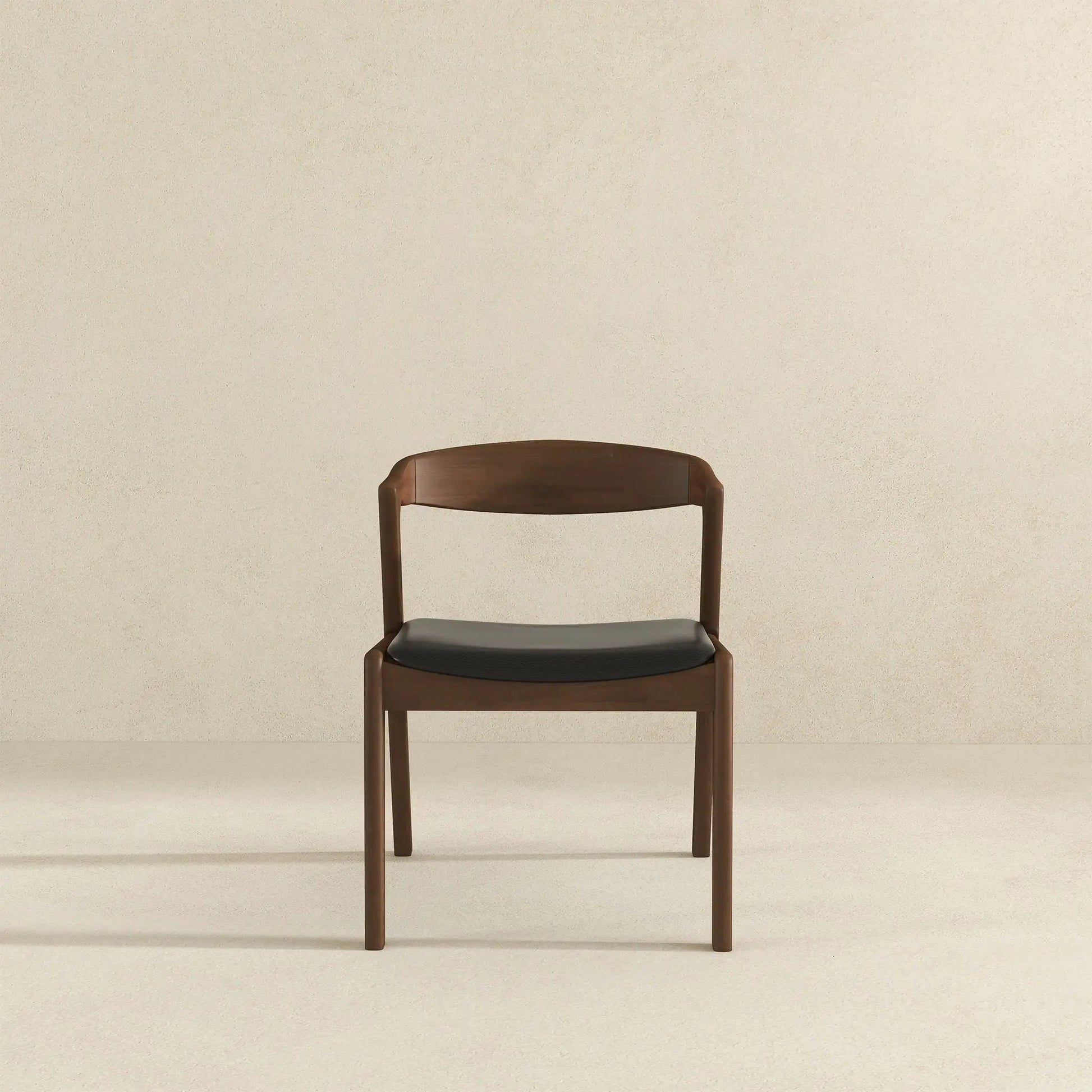 Dakota mid-century dining chair by Unique Piece Furniture; brown wood frame with black seat on Tampa Home & Garden Store