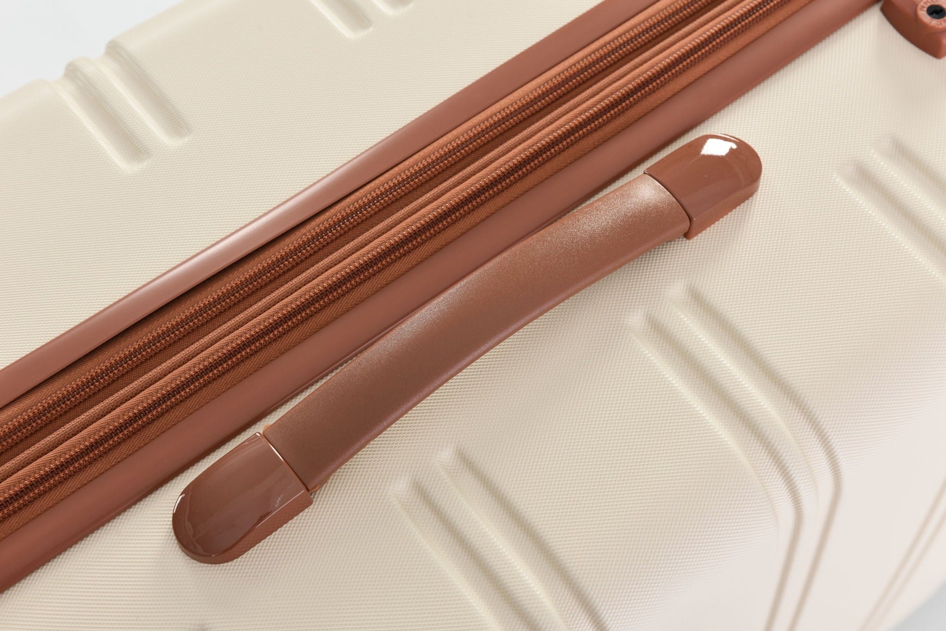 Hardshell luggage set 2-piece copper rose-gold zippers on beige shell HouseOfZazla on Tampa Home & Garden Store