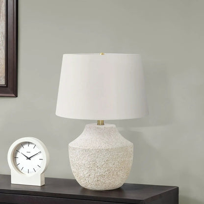 Table lamp with cream shade and concrete base by Unique Piece Furniture on a wood table on Tampa Home & Garden Store