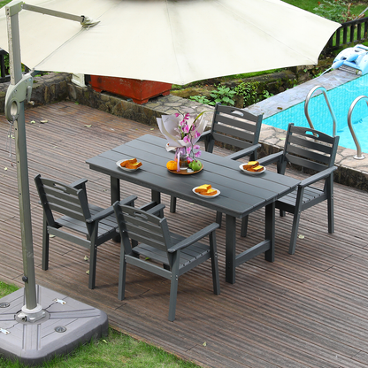 HDPE outdoor dining set with table and four dark gray chairs on a deck under an umbrella on Tampa Home & Garden Store
