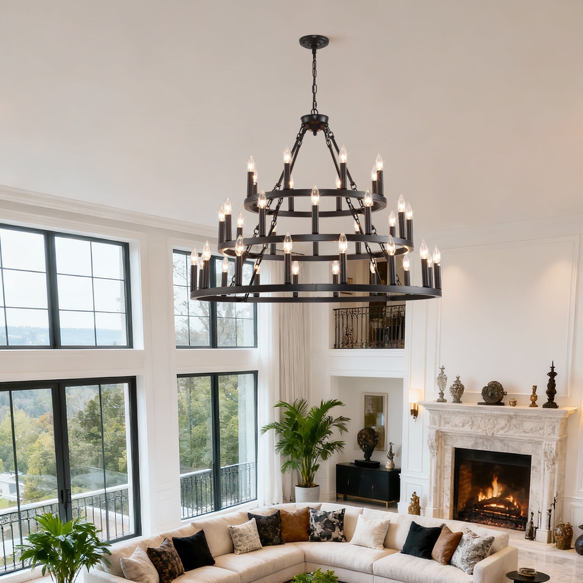 3-tier wagon wheel chandelier, black metal with candle bulbs, ceiling hung over living room on Tampa Home & Garden Store
