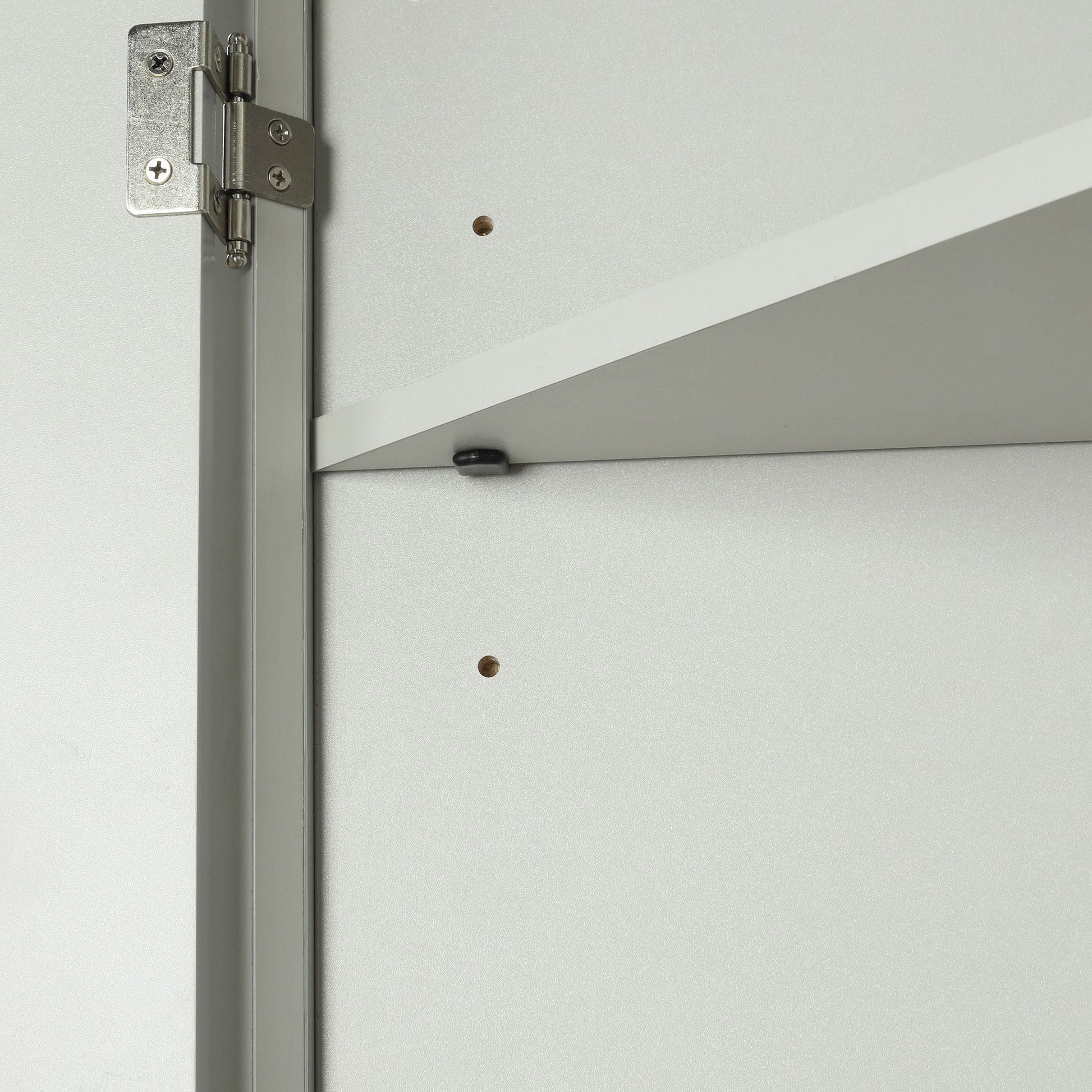 Triangle bathroom storage cabinet hinge close-up on gray interior panel with screws on Tampa Home & Garden Store