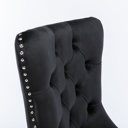 Tufted dining chair set in black velvet with silver nailhead trim along the edge on Tampa Home & Garden Store