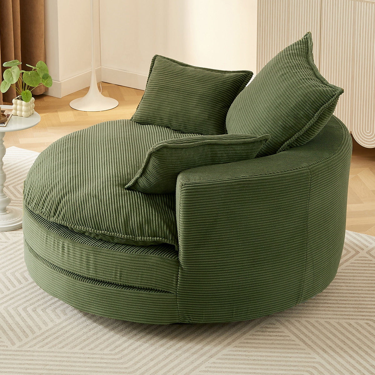 Swivel barrel chair with green corduroy upholstery and two cushions on Tampa Home & Garden Store