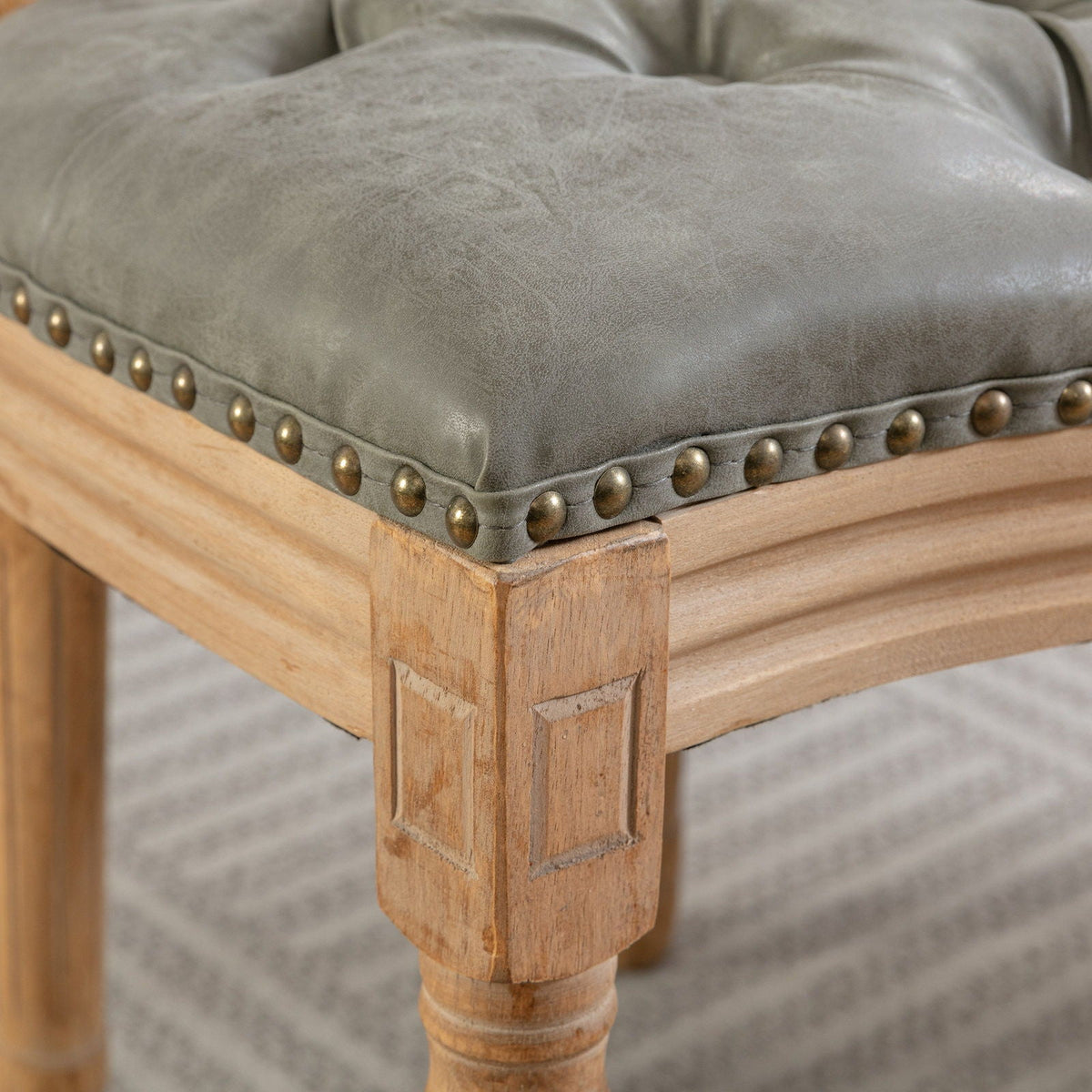 French style solid wood dining chair with nailhead trim in grey upholstery and light oak legs on Tampa Home & Garden Store