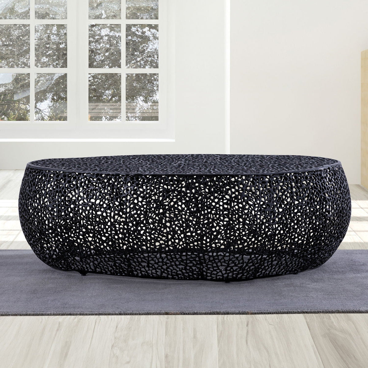 Oval black aluminum-frame coffee table with a dense openwork lattice design on Tampa Home & Garden Store