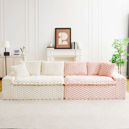 Multifunctional sofa with cream and blush chunky-knit throws in a bright living room on Tampa Home & Garden Store