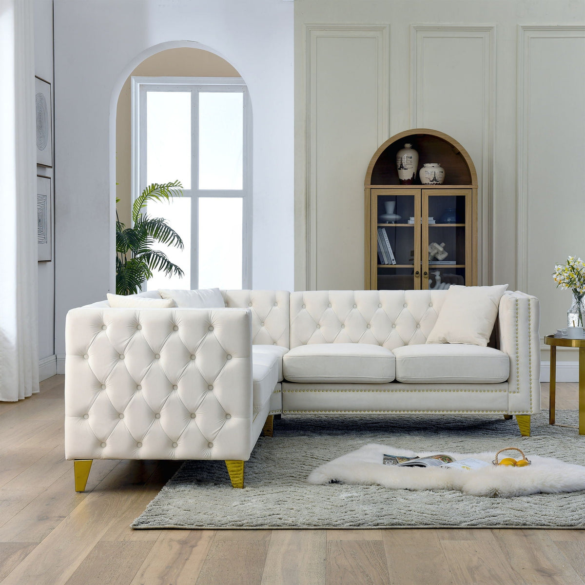 White tufted L-shaped corner sofa, 5-seat stationary sectional in a modern living room on Tampa Home & Garden Store